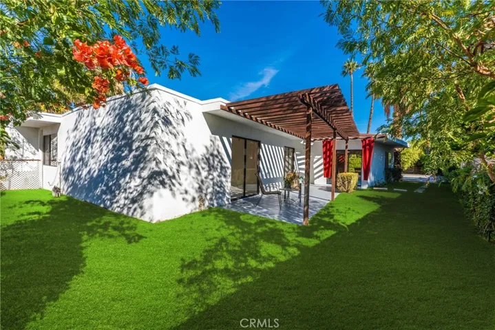 Secluded patio off master bedroom with just enough yard for Fido to have fun and with real grass too.