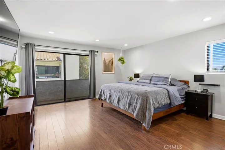 Primary bedroom with balcony