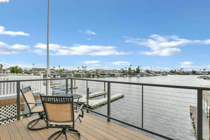 Waterfront decking with cable railing overlooking a canal