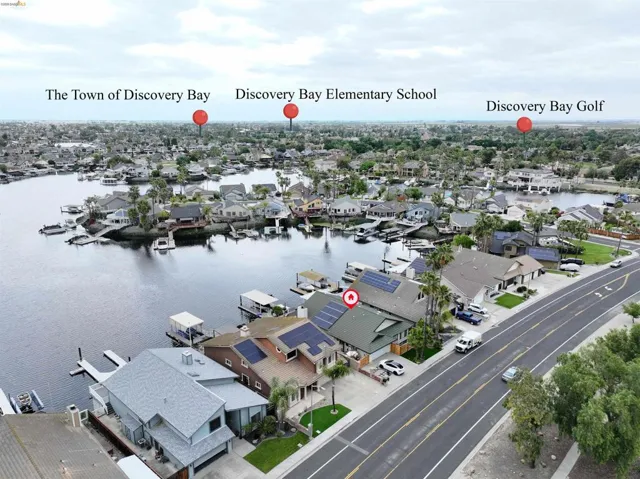 Aerial perspective showcasing waterfront properties with private docks