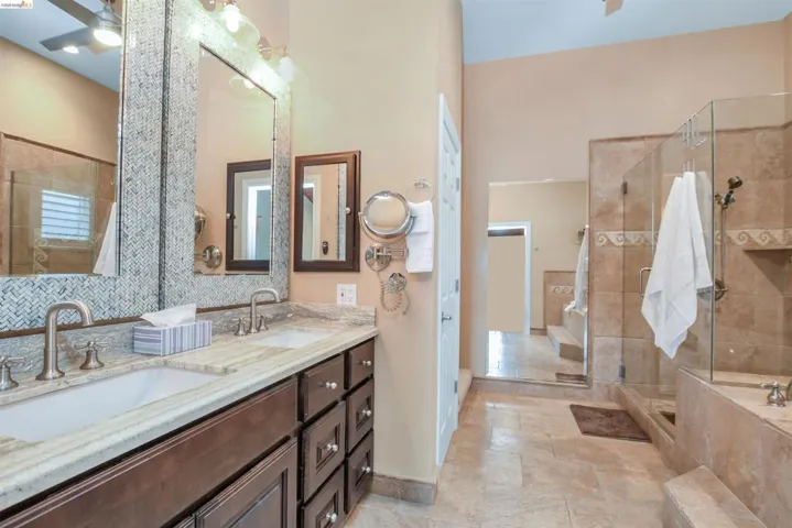 Dual vanity with stone countertop and integrated sinks