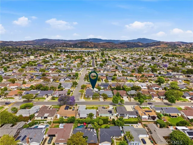 Overhead perspective showing the home’s large lot and parking areas.