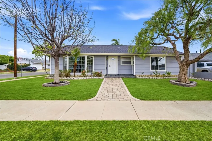 Welcoming front elevation with clean lines and classic single-story charm.