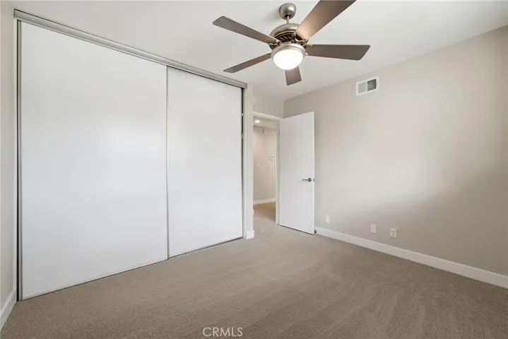 Secondary room offering flexibility for guests, office, or daily living + plus ceiling fan.