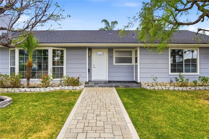 Inviting front walkway leading to a clean and welcoming entry.