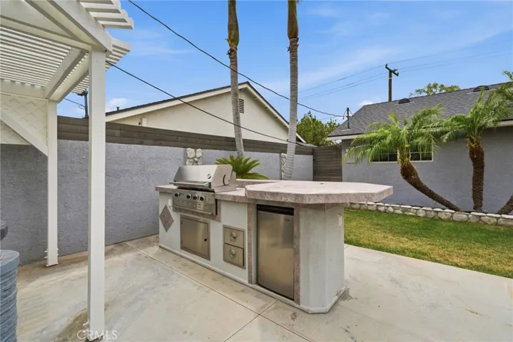 Built-in BBQ area creates an easy setup for outdoor cooking.