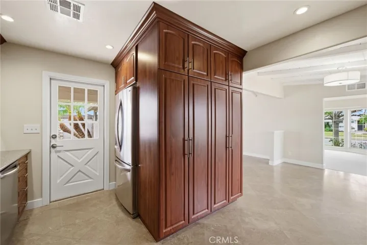 Self-closing drawers and roll-out shelving add thoughtful function.