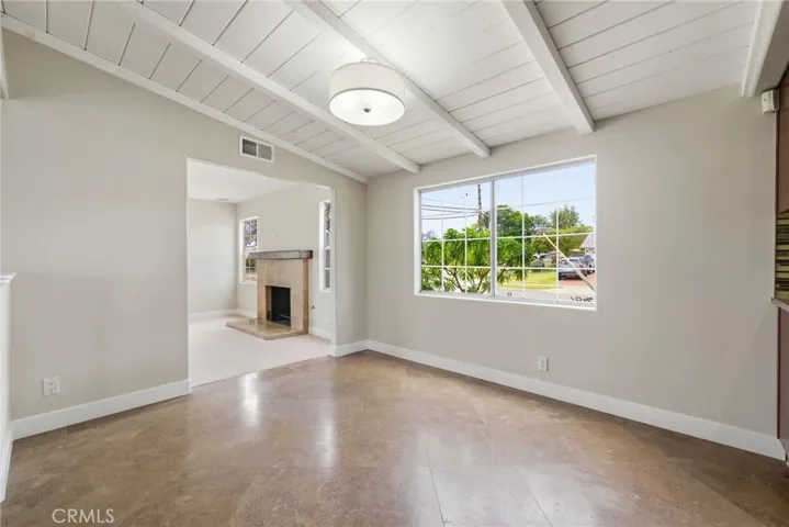Vaulted ceilings and natural light enhances the main living space throughout the day.