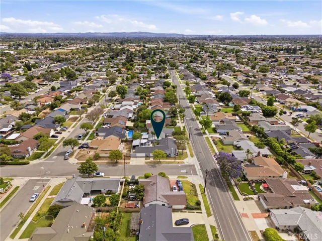 Aerial angle capturing the home’s position within an established Orange neighborhood.