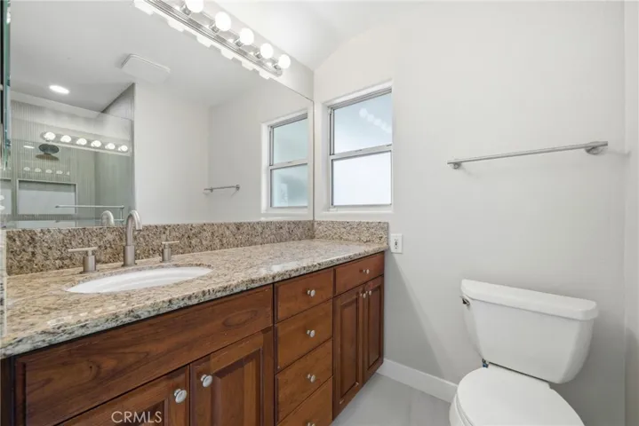 Updated en-suite bathroom with a remodeled walk-in shower.