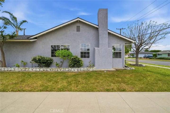 Front yard showcasing updated landscaping and a well-cared-for exterior.