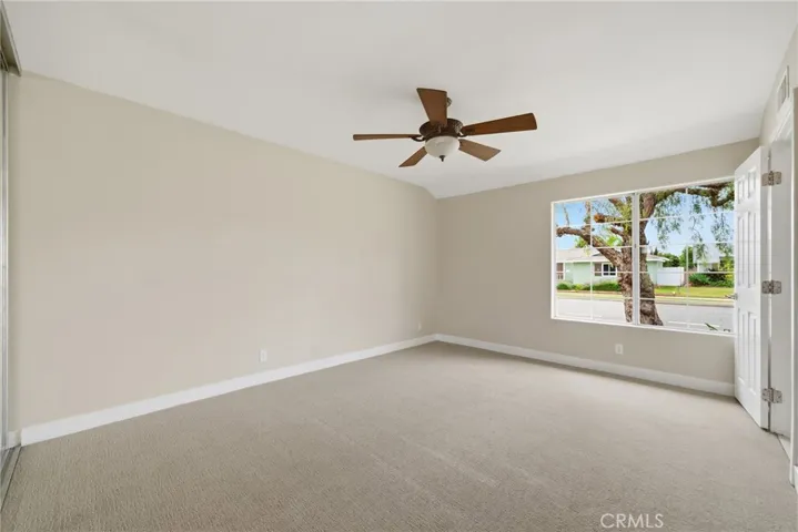 Primary bedroom BEFORE virtual staging + new carpet!