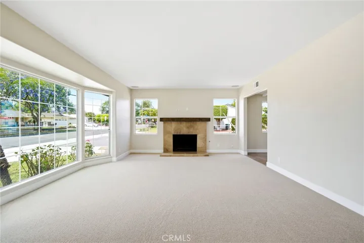 Family Room BEFORE virtual staging. New carpet and paint!