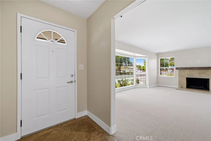 Entry opens into a comfortable family room with great natural light.
