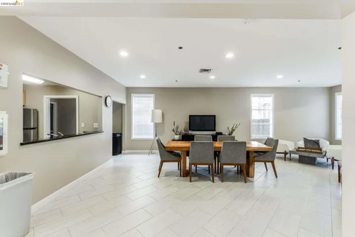 Spacious interior with light-toned tile flooring throughout