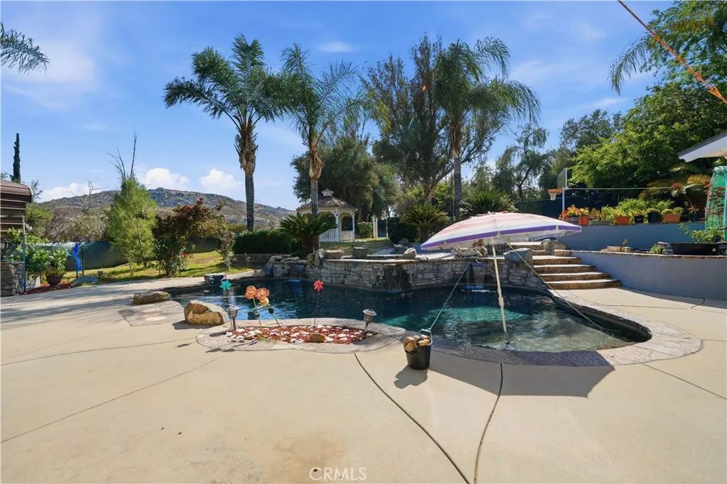 Mountain views surround the property with a variety of fruit and palm trees.