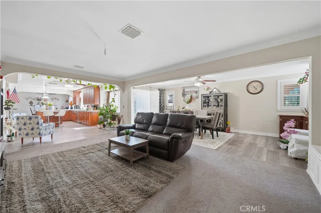 Family room view with kitchen and formal dining room area