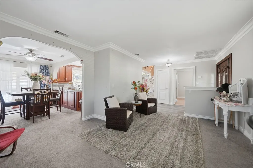View from the front living room, showing the breakfast table area to the left and front entry to the right.