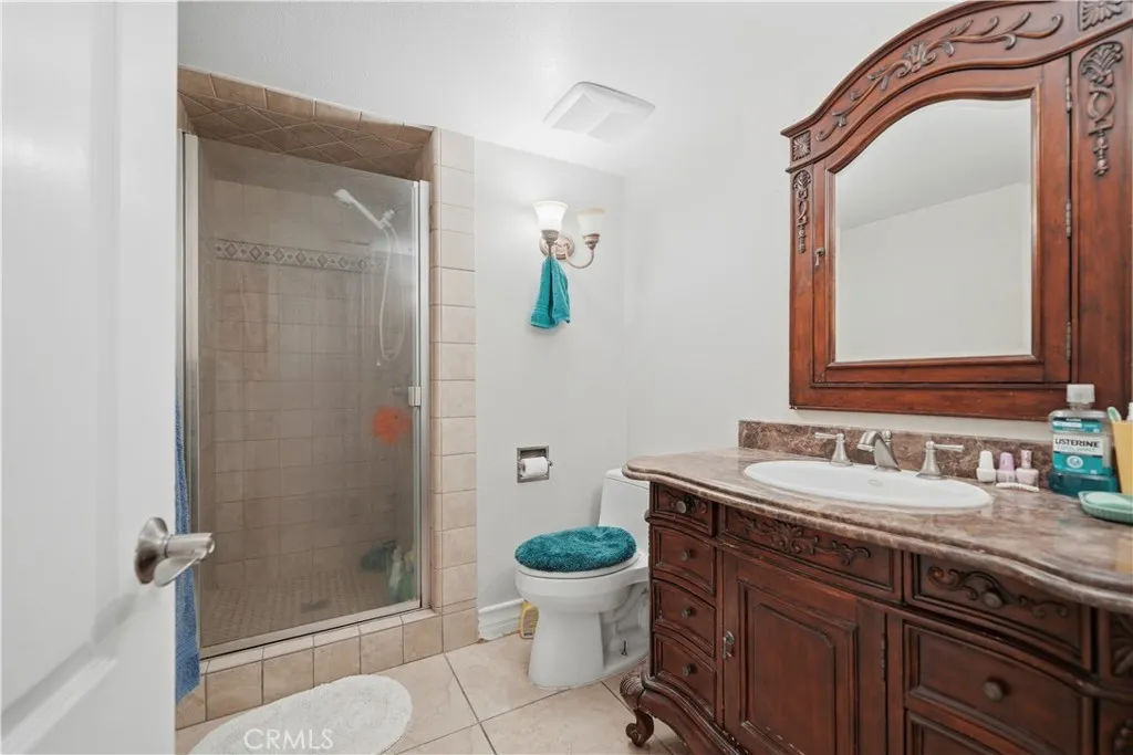 First floor bathroom with walk in shower and upgraded vanity cabinet.