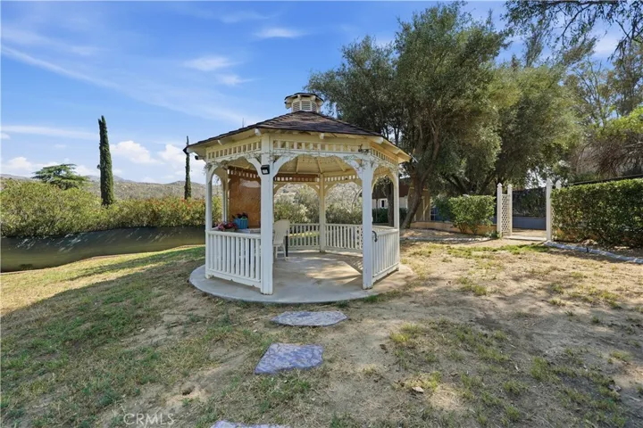 Victorian style gazebo with electricity sits on the knoll.