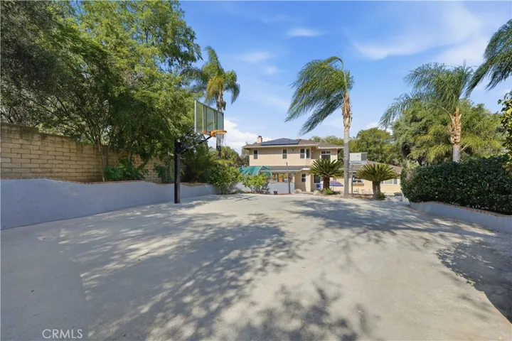 Large concrete area with basketball hoop