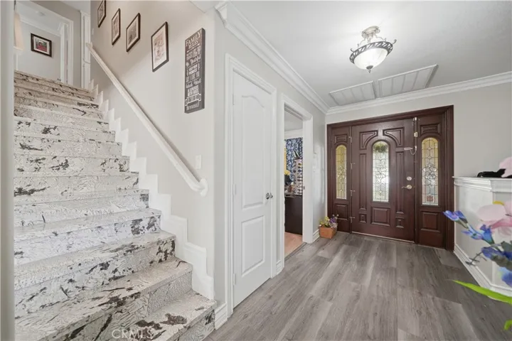 Entry door features hammered glass insets in the door and side lights.