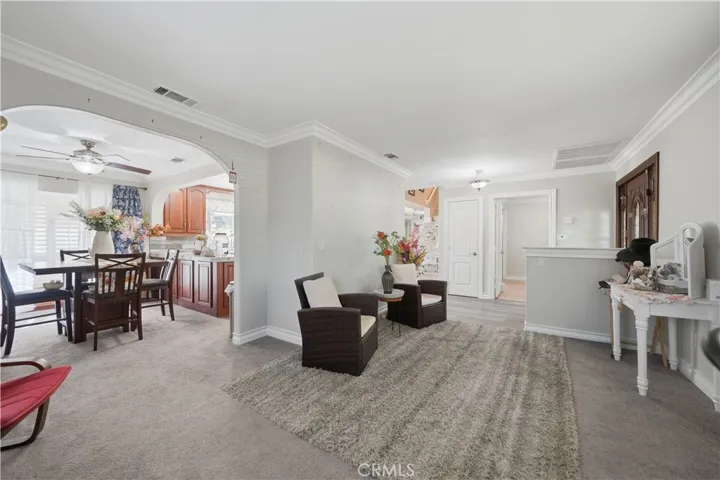 View from the front living room, showing the breakfast table area to the left and front entry to the right.