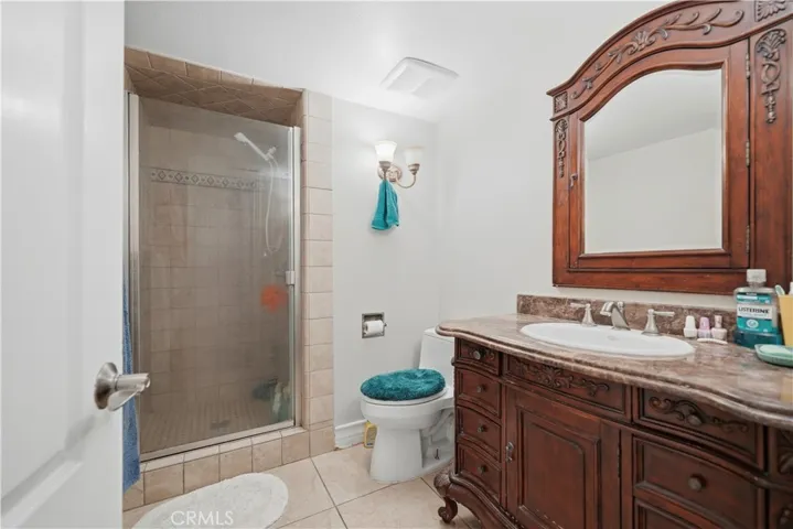First floor bathroom with walk in shower and upgraded vanity cabinet.