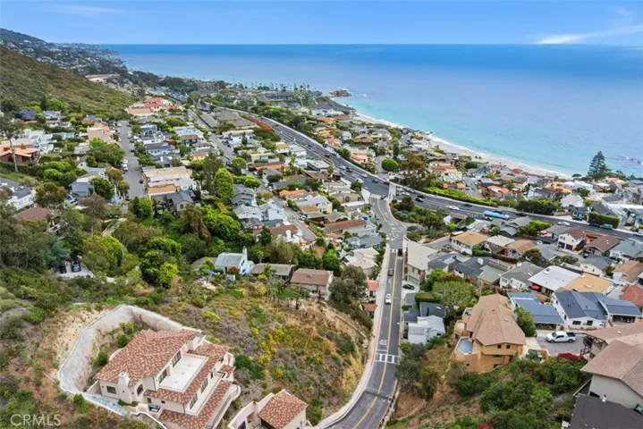 The current permitted plans have views from both the living area and deck as well as the primary bedroom and deck.  Please note, this image shows two lots. Lot for sale is closest to the ocean. Fencing in front shows the lot for sale.