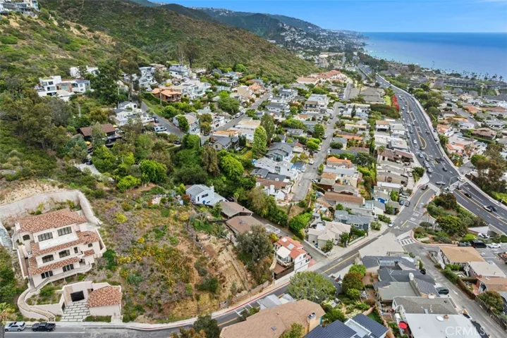 Lot is an easy walk to Victoria Beach. A tunnel that goes under the highway provides easy and safe access to the beach.  Please note, this image shows two lots. Lot for sale is closest to the ocean. Fencing in front shows the lot for sale.