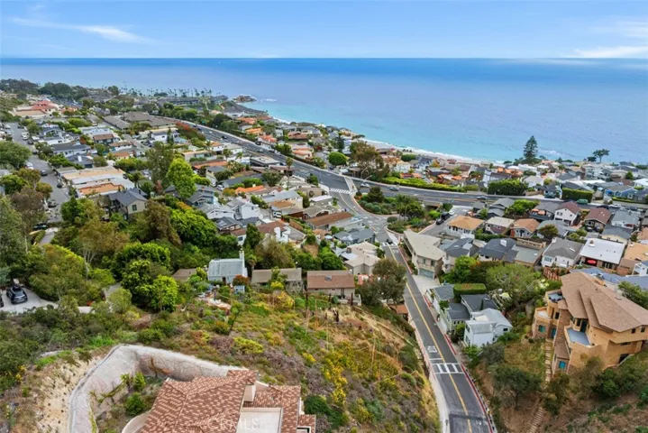 It's an easy walk to restaurants, beaches, coffee, parks, etc. It is approximately half a mile to the Montage Laguna Beach.  Please note, this image shows two lots. Lot for sale is closest to the ocean. Fencing in front shows the lot for sale.