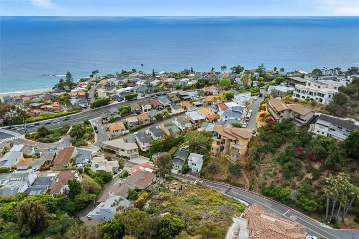 Northern view from drone photography.  Please note, this image shows two lots. Lot for sale is closest to the ocean. Fencing in front shows the lot for sale.