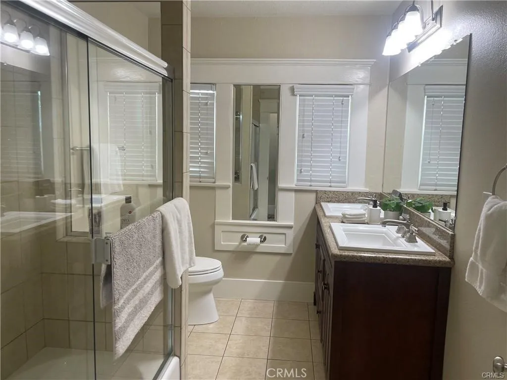 Hall bathroom with duel sinks, tub and shower.