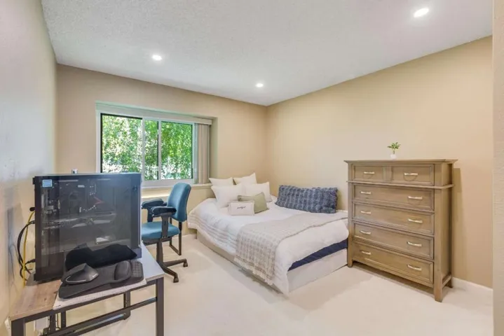 Approx 14'X11' spacious suite #2 with greenbelt views and double-pane windows.