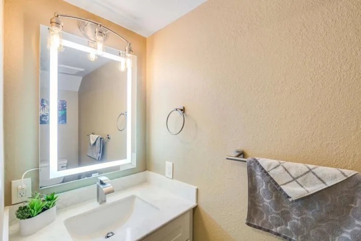 Half bathroom with a gorgeous LED light mirror