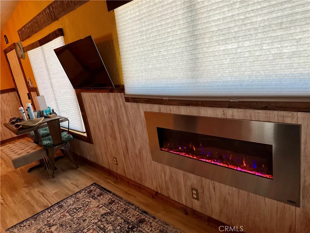 The home has an electronic fireplace that radiates heat for comfort and enjoyment on those cold evenings