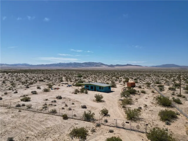 5 acre Wonder Valley home property ready to move in. The view and privacy or protected by Bureau Of Land Management public lands to the south.