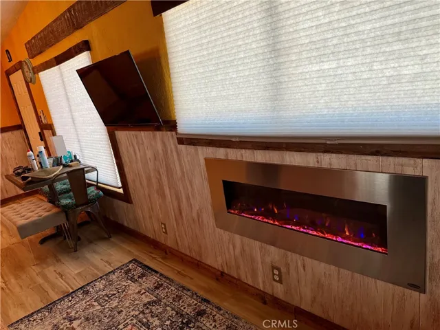 The home has an electronic fireplace that radiates heat for comfort and enjoyment on those cold evenings
