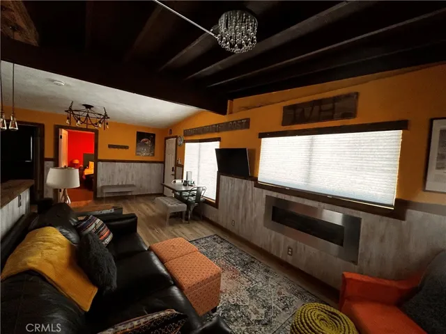 The living room features a wonderful view and an electronic fireplace