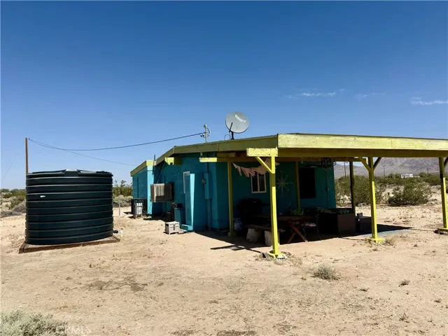 Hauled water storage and covered patio