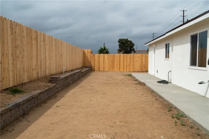 Back Yard & Retaining Brick Wall