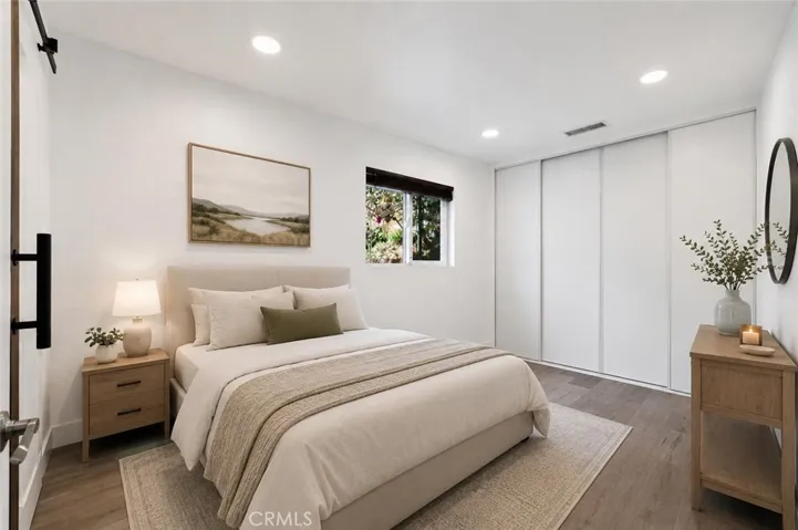 Primary Bed - This image is virtually staged.