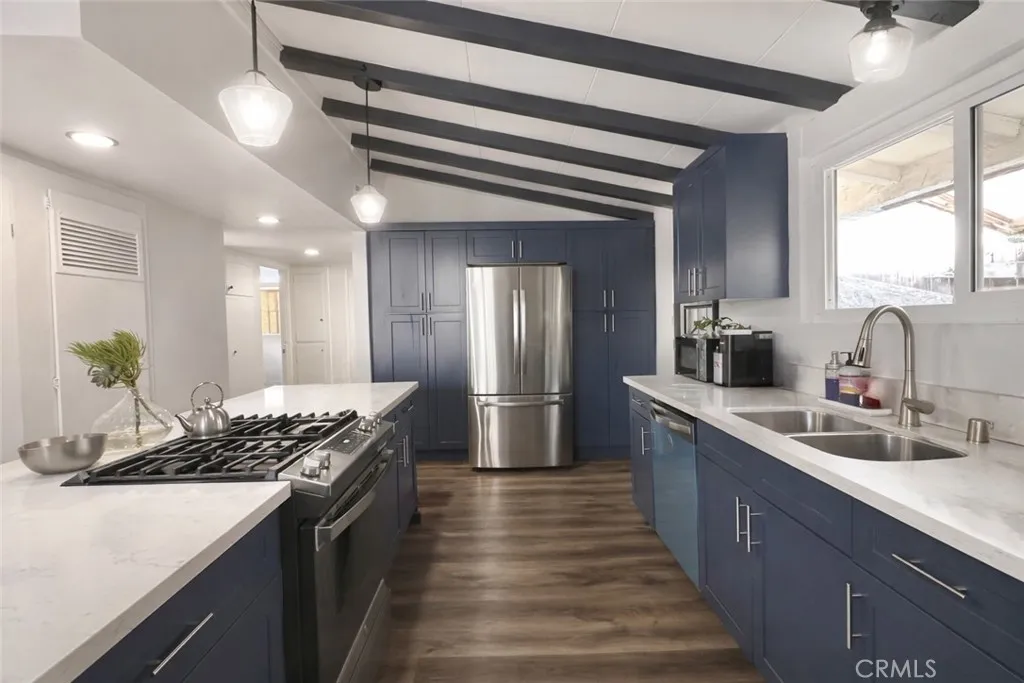 Kitchen with new countertops and stainless steel appliances