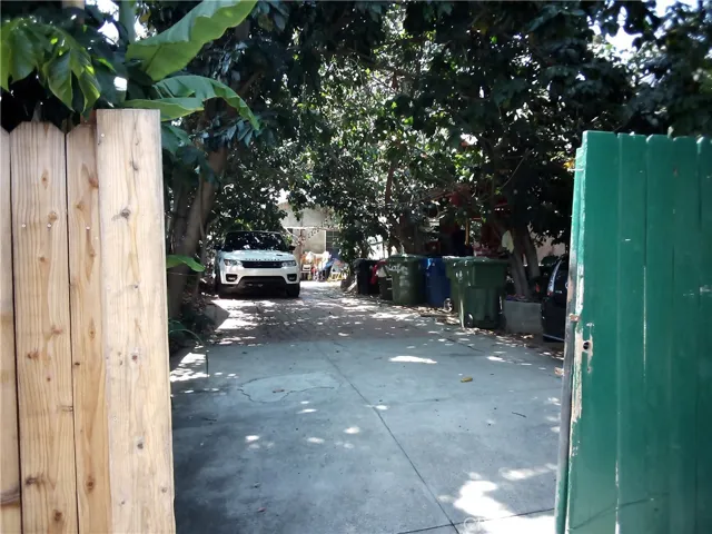 Charming walkway lined with trees and vintage details. A glimpse into a hidden pocket of East Hollywood full of potential.