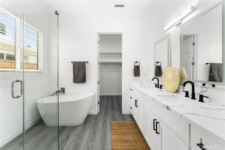 master bathroom dual sinks, tub and separate shower