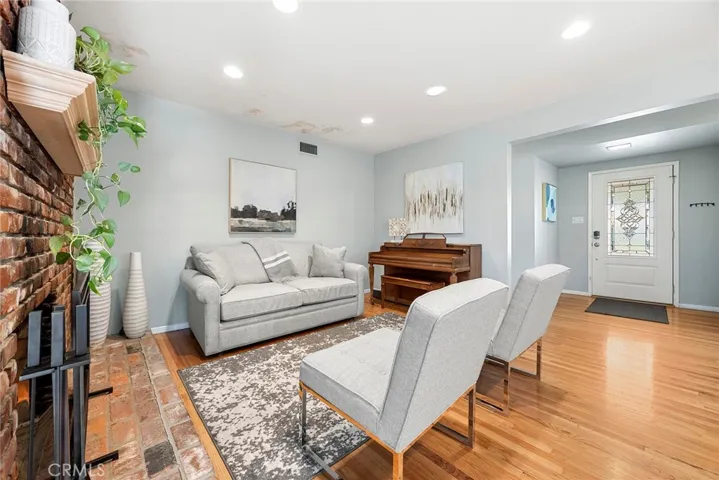 View of Living Room from the other side, with front door to the right and Dining Room further to the right (now shown).