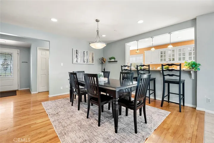 View from other side of Dining Room, Kitchen to the right, front door on the left.