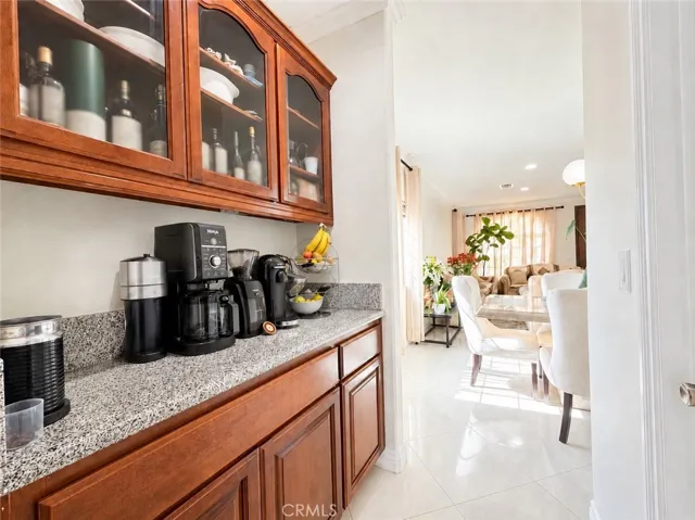 Butler's pantry on left and walk-in pantry on right. Dining room straight through