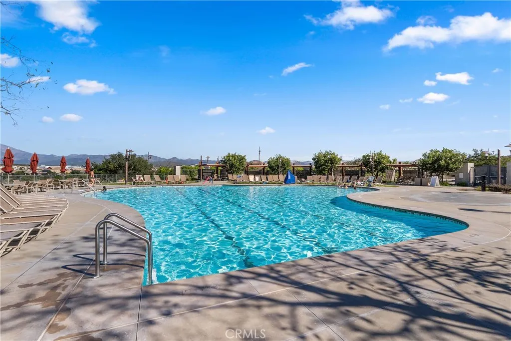 Resort-style community pool with stunning mountain and neighborhood views.