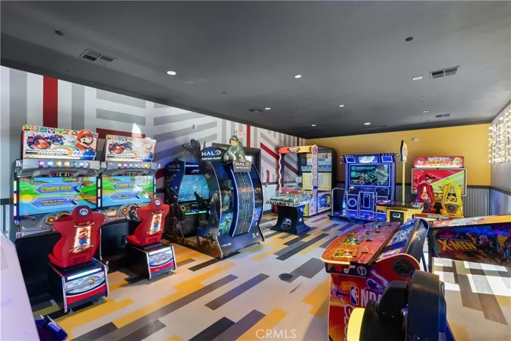 Resident game room featuring arcade-style entertainment for all ages to enjoy.